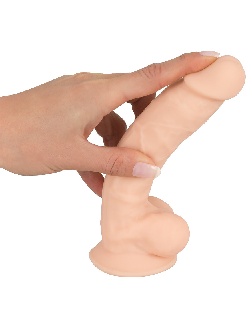 En hand som böjer produkten Silexd Premium Silicone Dildo